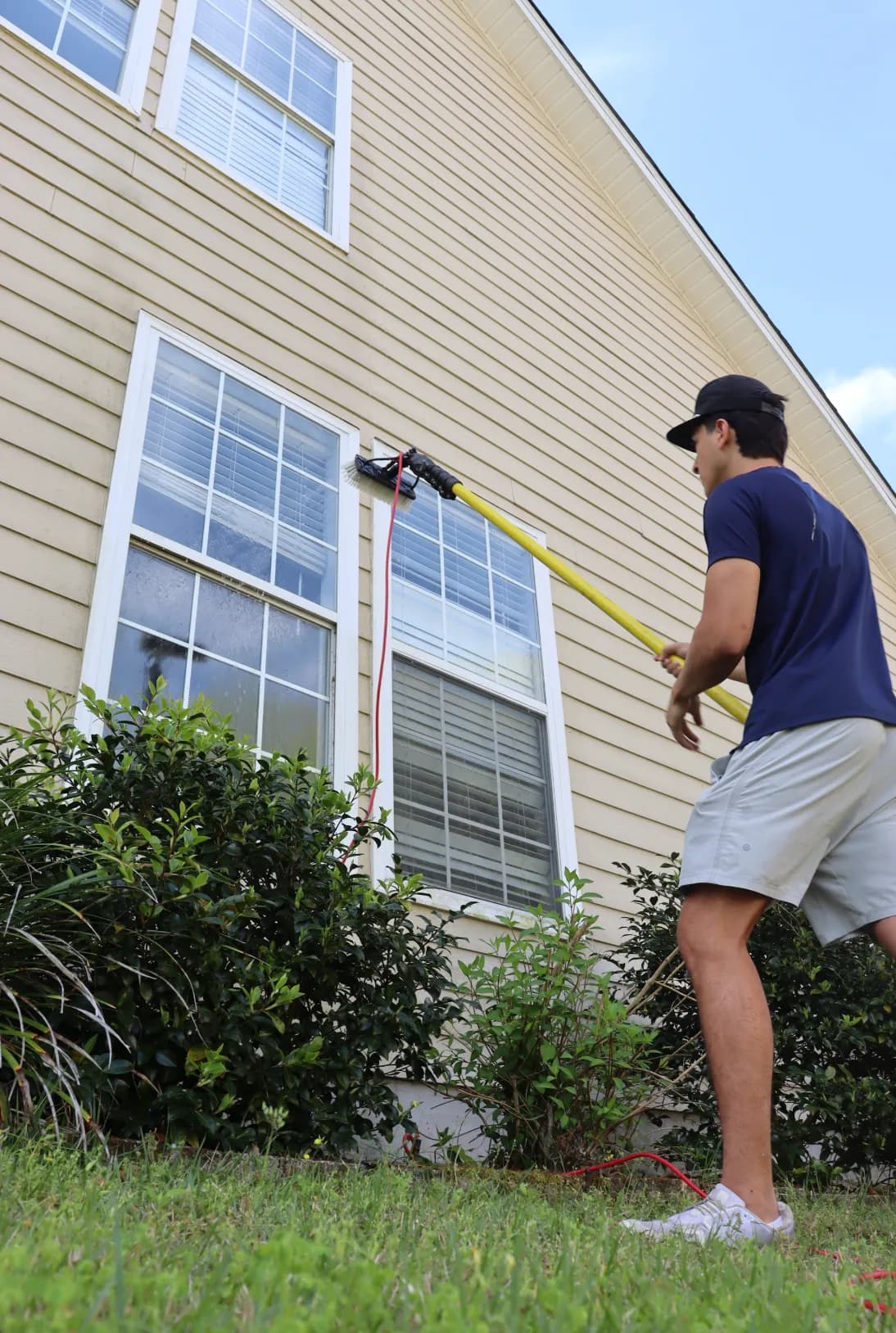 Reaching upper-floor windows from the ground with a pure-water pole, Tallahassee FL